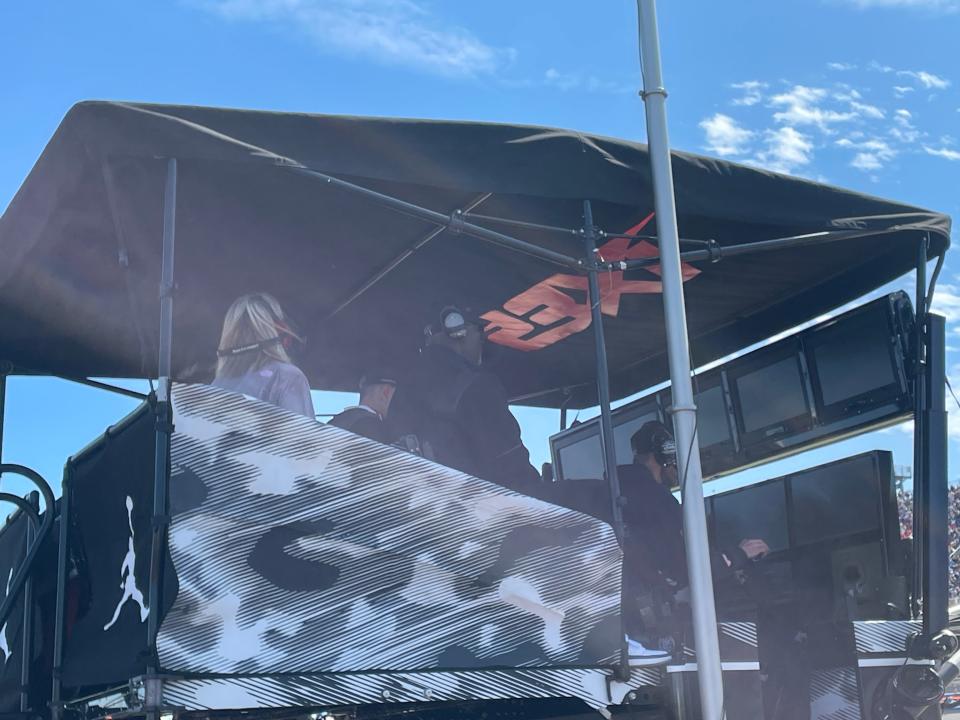 23XI Racing owner and former NBA legend Michael Jordan sits a top of the No. 45 car pit box.