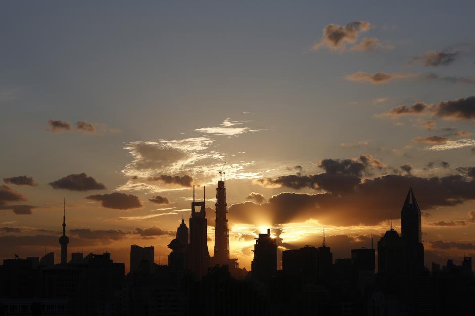 The sunrise rises over the skyline of Lujiazui financial district of Pudong in Shanghai September 27, 2013. Shanghai will launch its trial free trade zone (FTZ) on September 29, featuring liberalized foreign exchange and interest rates in the form of new financial products, local media reported. (REUTERS/Aly Song)