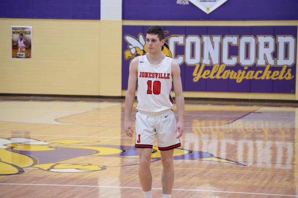 Comet senior Carter Rounds (10) takes the court in the District title game.