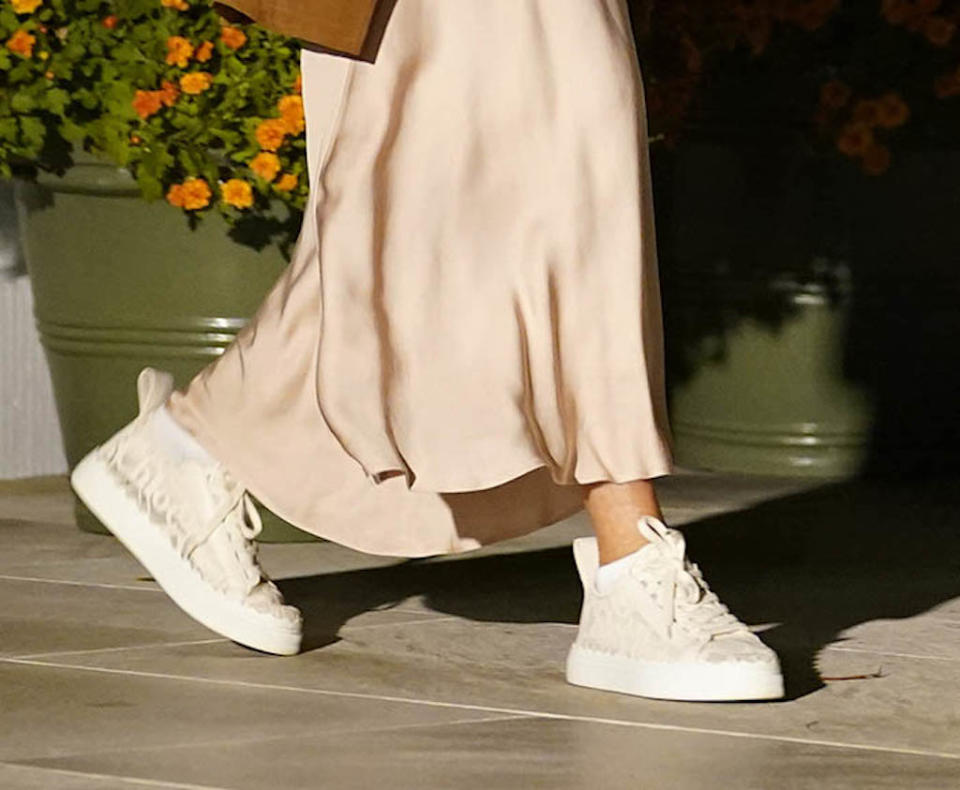 A closer look at First Lady Jill Biden’s cream-colored Chloe sneakers. - Credit: AP