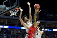 <p>George Conditt IV #4 and Marial Shayok #3 of the Iowa State Cyclones block Duane Washington Jr. #4 of the Ohio State Buckeyes during the first half in the first round game of the 2019 NCAA Men’s Basketball Tournament at BOK Center on March 22, 2019 in Tulsa, Oklahoma. (Photo by Stacy Revere/Getty Images) </p>