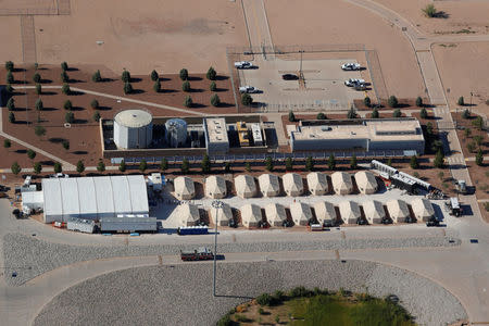 Immigrant children, many of whom have been separated from their parents under a new "zero tolerance" policy by the Trump administration, are being housed in tents next to the Mexican border in Tornillo, Texas, U.S. June 18, 2018. REUTERS/Mike Blake