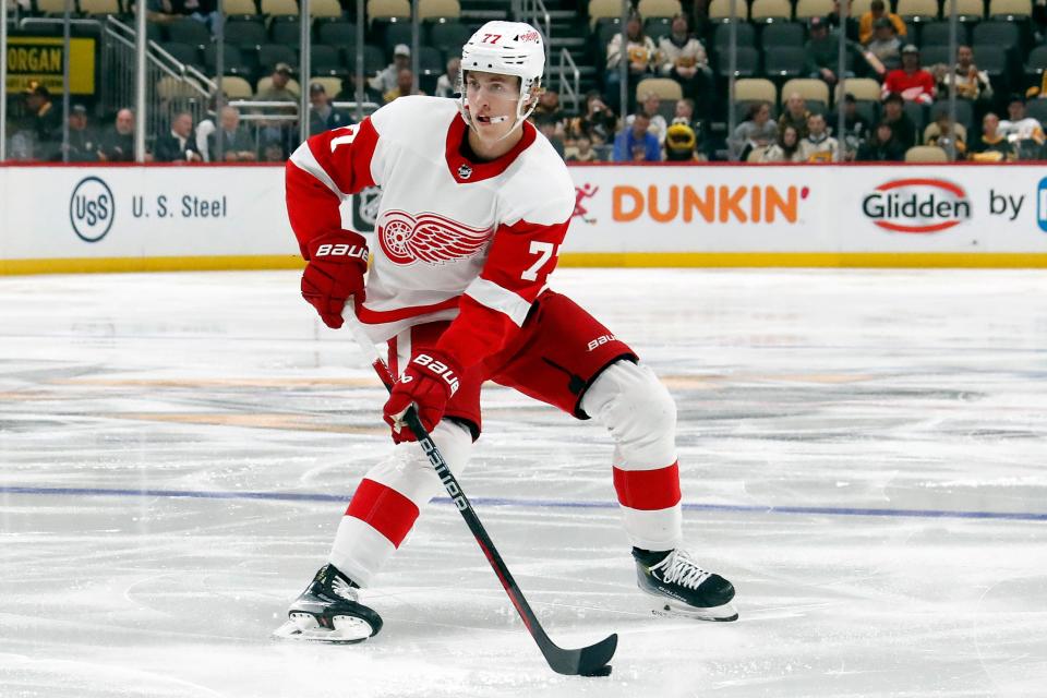 Detroit Red Wings defenseman Simon Edvinsson (77) handles the puck against the Pittsburgh Penguins during the second period at PPG Paints Arena in Pittsburgh on Wednesday, Oct. 4, 2023.
