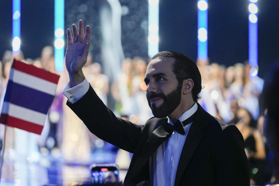 El Salvador's President Nayib Bukele waves while attending the 72nd Miss Universe Beauty Pageant in San Salvador, El Salvador, Saturday, Nov. 18, 2023. (AP Photo/Moises Castillo)