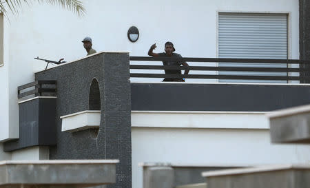 Members of the Libyan internationally recognised government forces take position during fighting with Eastern forces in Ain Zara, Tripoli, Libya April 20, 2019. REUTERS/Hani Amara