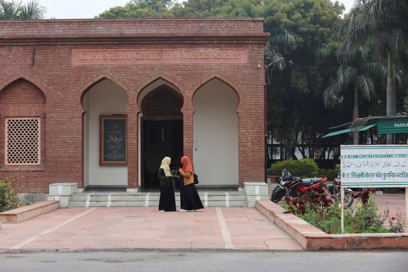 Women talk to each other inside the premises of Aligarh Muslim University (AMU) in Aligarh