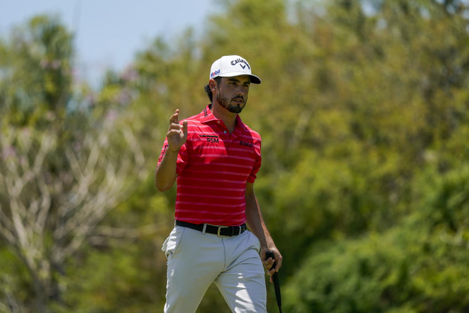 Abraham Ancer, of Mexico, walks on the course on the second green during the first round of the Mexico Open at Vidanta in Puerto Vallarta, Mexico, Thursday, April 28, 2022. (AP Photo/Eduardo Verdugo)