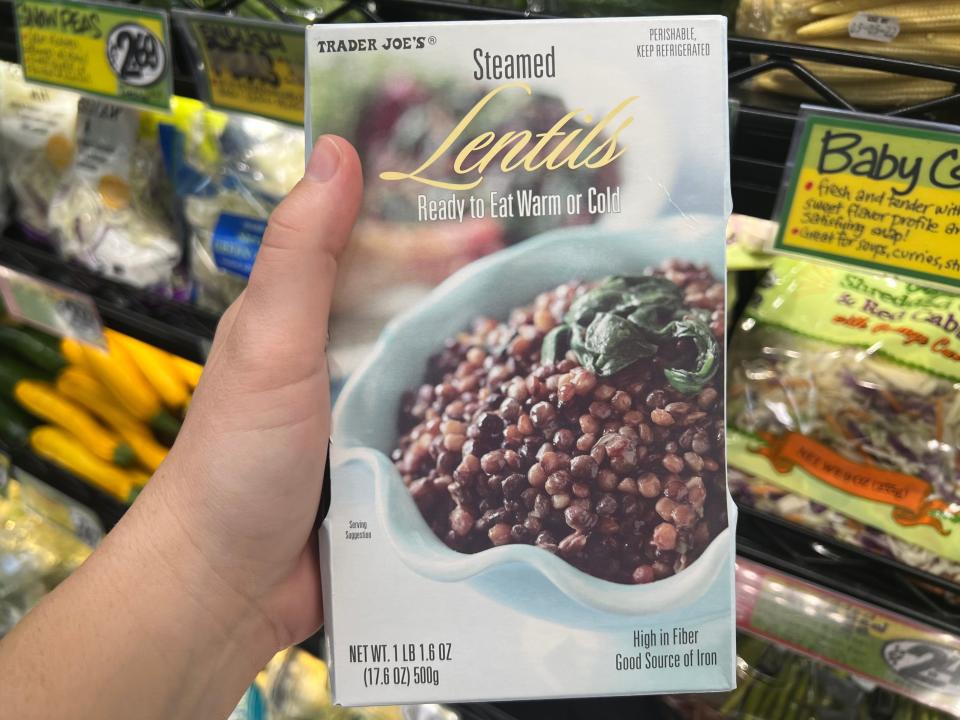 The writer holds a box of lentils