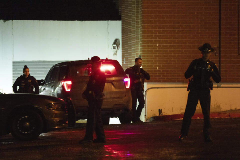 Law enforcement personnel stand guard next to a garage entrance at the Latah County Courthouse after Bryan Kohberger, who is accused of killing four University of Idaho students in November 2022, arrived in a police motorcade at the courthouse, Wednesday, Jan. 4, 2023, in Moscow, Idaho, following his extradition from Pennsylvania. (AP Photo/Ted S. Warren)