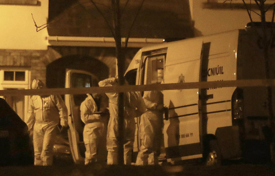 The children's mother was taken to hospital after the gruesome discovery. Pictured are forensic police at the scene.