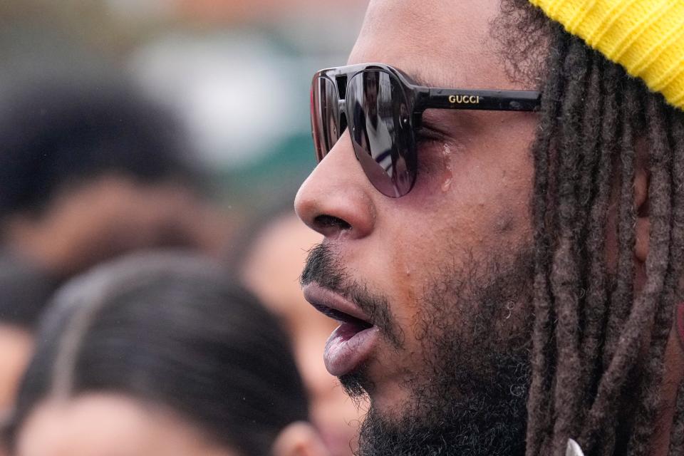 A tear rolls down Dejaun Sharp’s cheek while he speaks Sunday during a community press event demanding justice in the fatal shooting of 13-year-old Sin'Zae Reed on Oct. 12 at the Wedgewood Apartments complex in Columbus' Hilltop neighborhood.  Sharp is with Columbus Downtownerz, a local activism group.