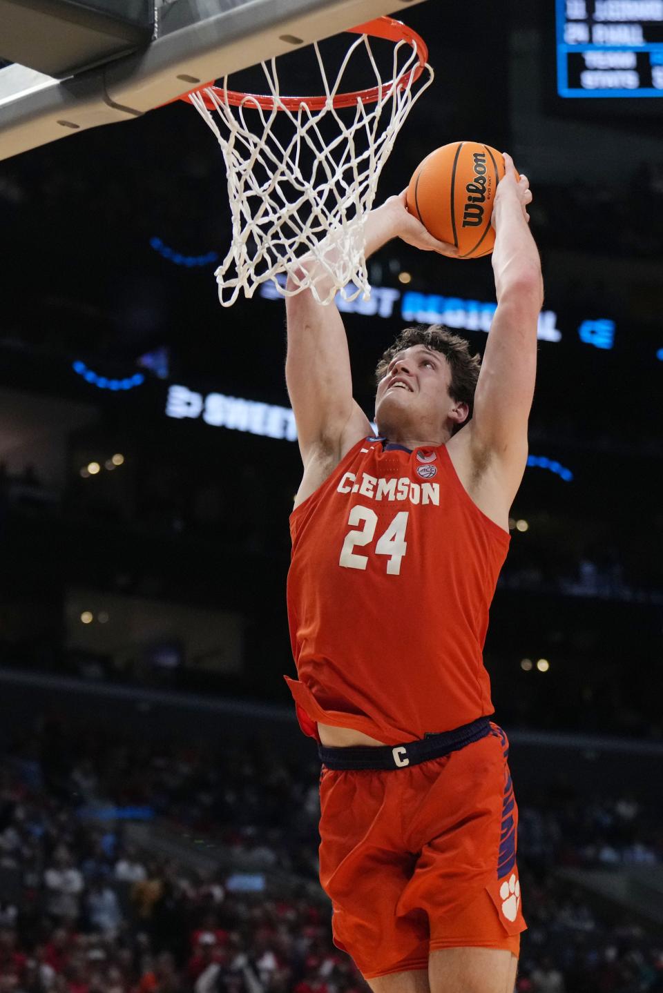 Clemson center PJ Hall dunks during Thursday night's NCAA Tournament victory against Arizona, sending the Tigers to the Elite Eight.