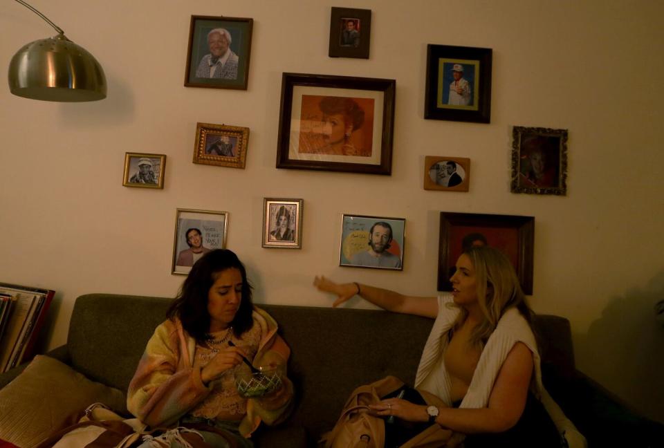 Two women talking on a couch