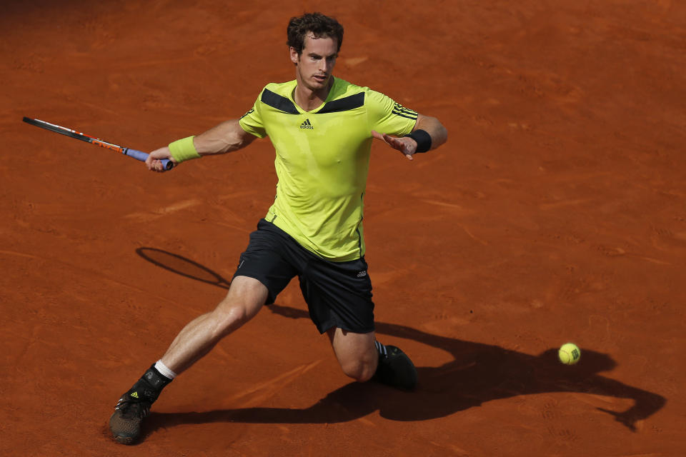 Andy Murray from Britain returns the ball during a Madrid Open tennis tournament match against Santiago Giraldo from Colombia in Madrid, Spain, Thursday, May 8, 2014. (AP Photo/Andres Kudacki)