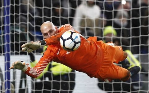 Chelsea's Argentinian goalkeeper Willy Caballero saves the penalty from Norwich City's Portuguese striker Nelson Oliveira - Credit: AFP/Getty