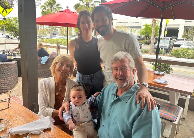 <p>Courtesy of Nick Buro</p> Kathy Brandel and Ralph Hendry, Nick Buro and his partner Kerri Fennelly and their 13-month-old son "Sal."