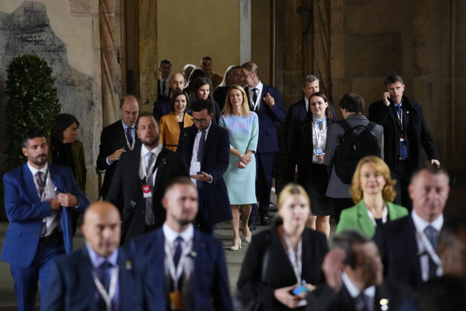 Estonia's Prime Minister Kaja Kallas, center, walks with other leaders after a group photo during meeting of the European Political Community at Prague Castle in Prague, Czech Republic, Thursday, Oct 6, 2022. Leaders from around 44 countries are gathering Thursday to launch a "European Political Community" aimed at boosting security and economic prosperity across the continent, with Russia the one major European power not invited. (AP Photo/Petr David Josek)