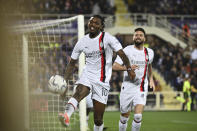 AC Milan's Rafael Leao, left, celebrates after scoring their side's second goal of the game during the Serie A soccer match between Fiorentina and AC Milan at the Artemio Franchi Stadium in Florence, Italy, Saturday March 30, 2024. (Massimo Paolone/LaPresse via AP)