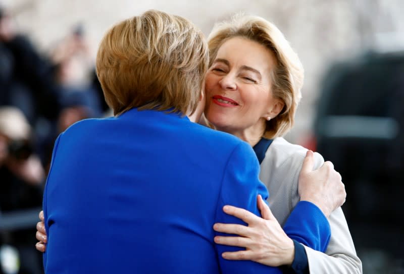 German Chancellor Angela Merkel welcomes European Commission President Ursula von der Leyen at the Libya summit in Berlin