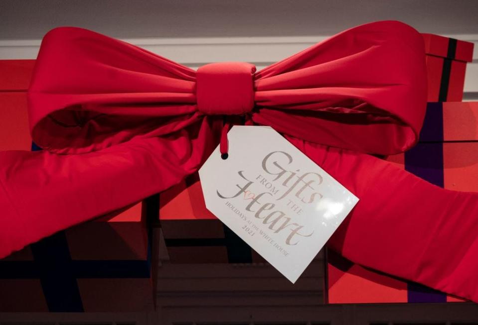A red ribbon with a tag reading "Gifts from Home" as part of the 2021 White House Christmas decorations.