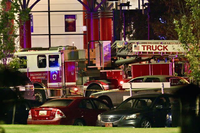 <p>Jerry Jackson/Baltimore Sun/Tribune News Service via Getty</p> Fire department staged behind a campus dorm after multiple people are shot at Morgan State University on Oct. 3, 2023, in Baltimore