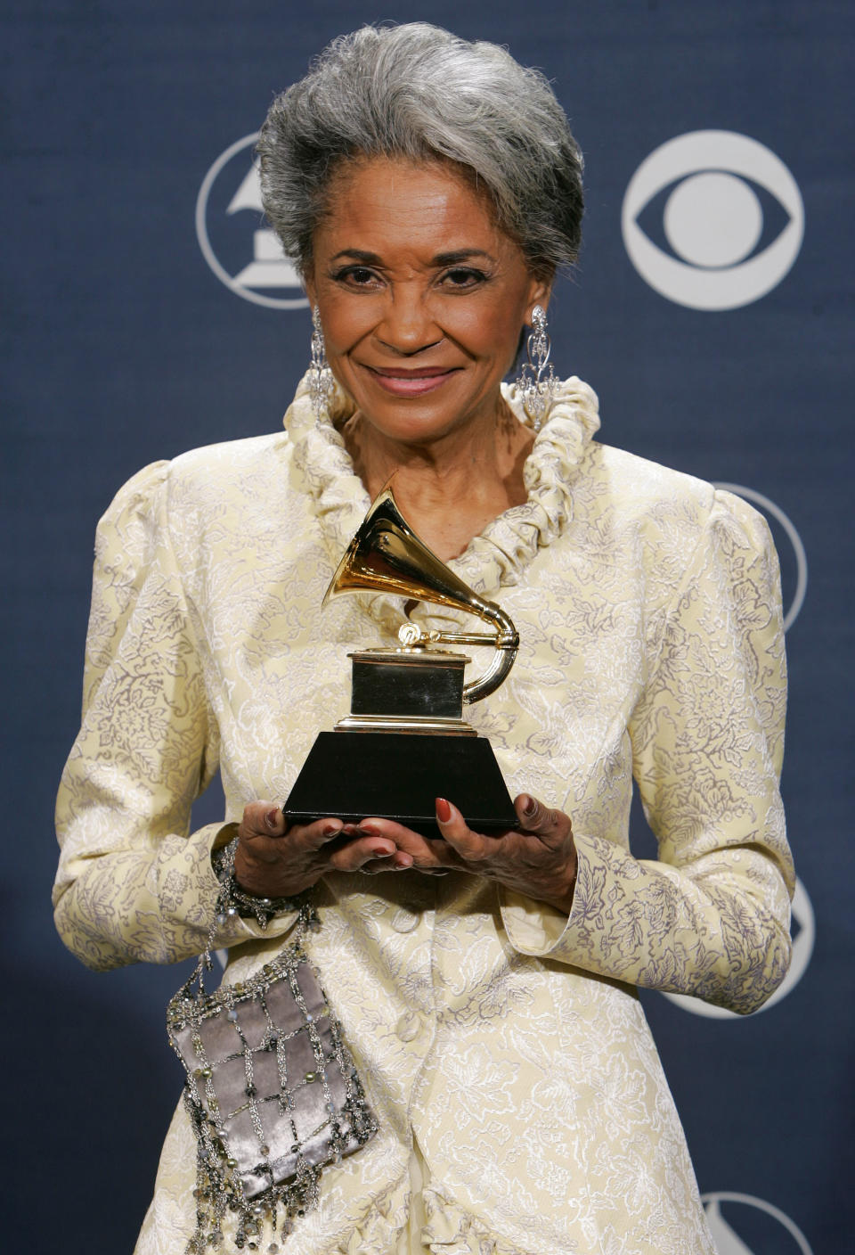FILE - In this Feb. 13, 2005 file photo, Nancy Wilson poses with her award for best jazz vocal album for "R.S.V.P. (Rare Songs, Very Personal)" at the 47th Annual Grammy Awards in Los Angeles. Grammy-winning jazz and pop singer Wilson has died at age 81. Her manager Devra Hall Levy tells The Associated Press late Thursday night, Dec. 13, 2018, that Wilson died peacefully after a long illness at her home in Pioneertown, a California desert community near Joshua Tree National Park. (AP Photo/Reed Saxon, File)