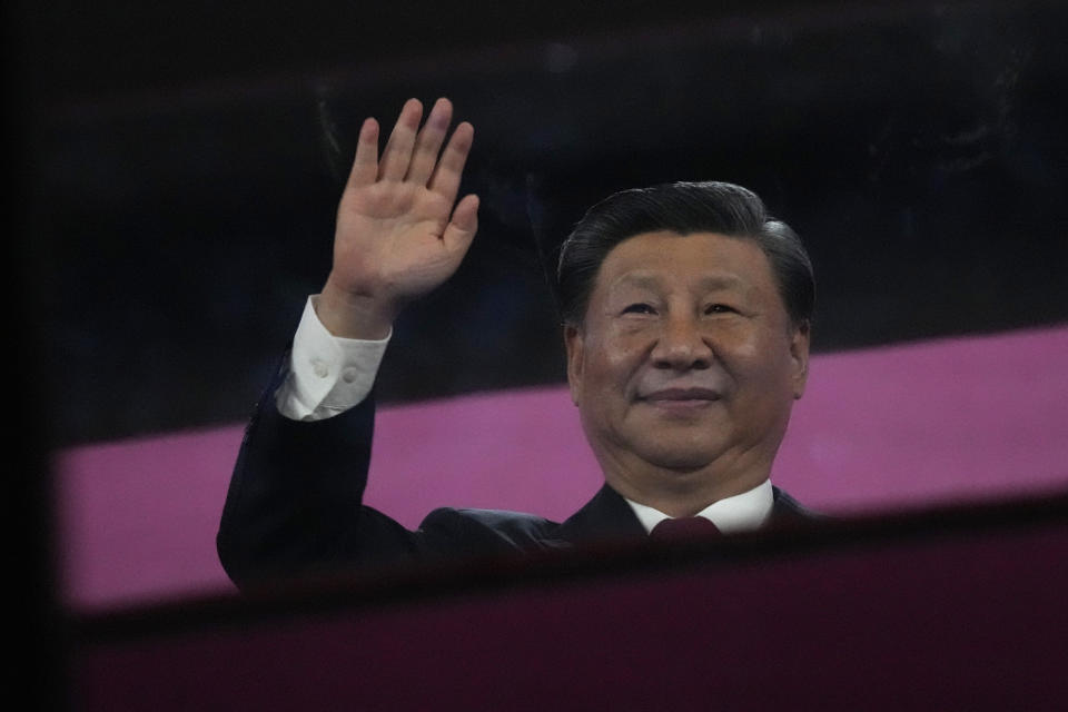 Chinese President Xi Jinping waves during the opening ceremony of the 19th Asian Games in Hangzhou, China, Saturday, Sept. 23, 2023. (AP Photo/Lee Jin-man)