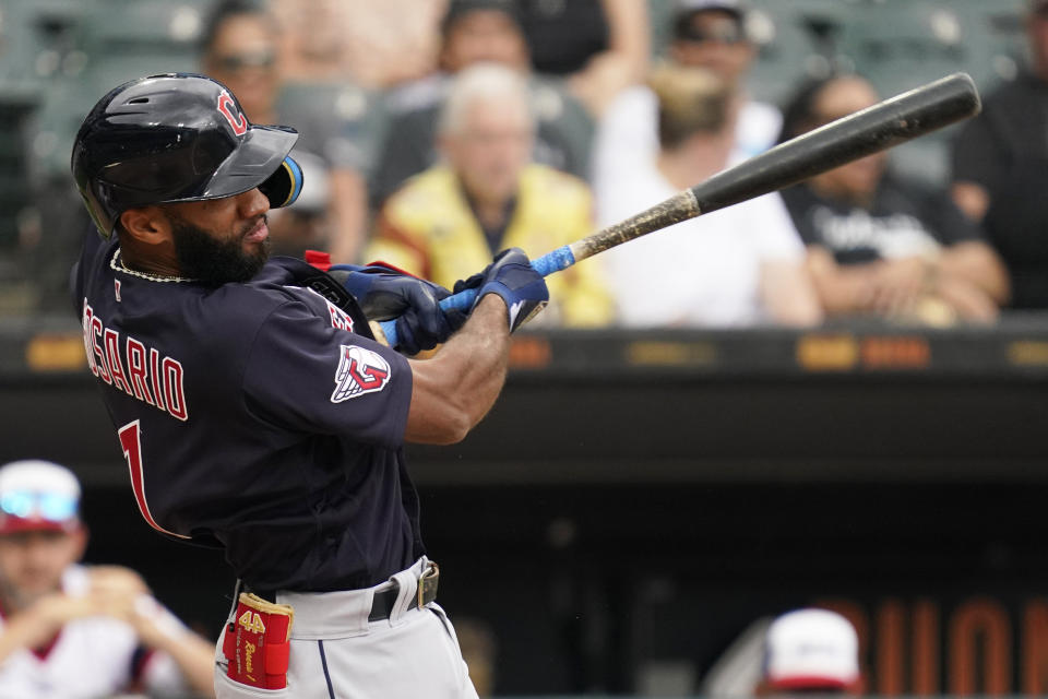 Cleveland Guardians' Amed Rosario hits a double during the third inning of a baseball game against the Chicago White Sox in Chicago, Sunday, July 24, 2022. (AP Photo/Nam Y. Huh)