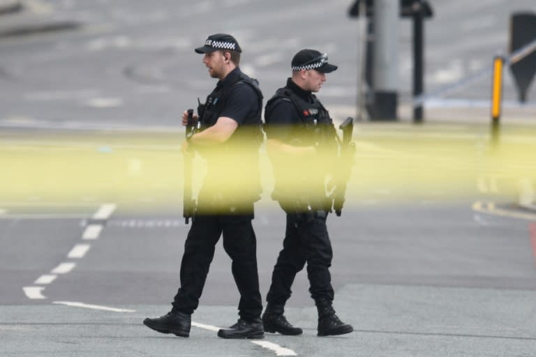 Armed police patrol near Manchester Arena on May 23, 2017 following a deadly terror attack in the city in northwest England