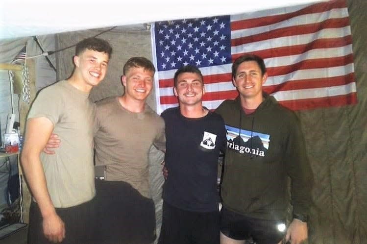 Army National Guard soldiers, from left, Ian Bacon, Jeremy Brooket, Mitchell Ramsey and Quin Davis, pose for a photo inside their tent while stationed in Syria. The soldiers have been deployed to Syria since October. The deployment is a one-year term, and they are expected to return home Oct. 23.