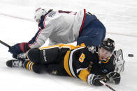 Pittsburgh Penguins' Michael Bunting (8) collides with Columbus Blue Jackets' Ivan Provorov during the first period of an NHL hockey game in Pittsburgh, Thursday, March 28, 2024. (AP Photo/Gene J. Puskar)