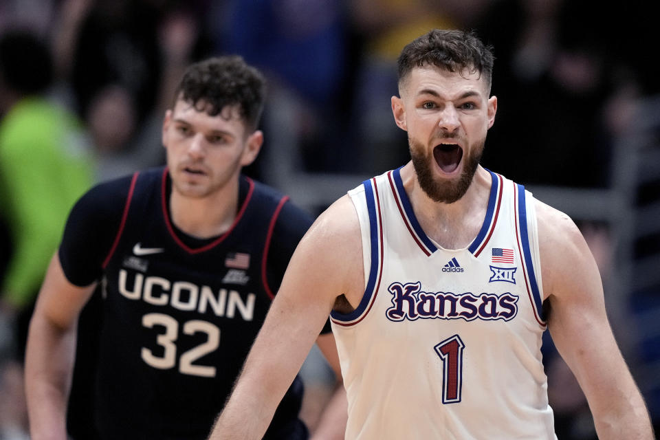 Kansas center Hunter Dickinson (1) celebrates during the second half of an NCAA college basketball game against UConn Friday, Dec. 1, 2023, in Lawrence, Kan. Kansas won 69-65. (AP Photo/Charlie Riedel)