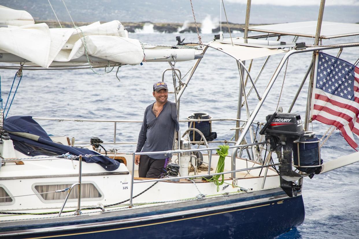 Dustin Reynolds and his sailboat Rudis, achieved the GUINNESS WORLD RECORDS® title for the first solo voyage around the world by a double amputee (arm and leg).