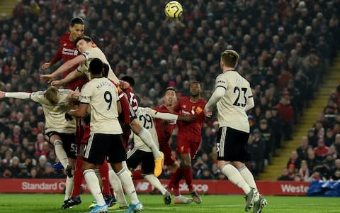 Virgil van Dijk rises highest to head in Liverpool's opener - Credit: Getty images