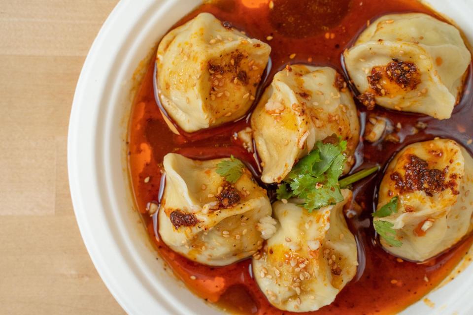 Xi'an Famous Foods' spicy and sour pork dumplings in chili oil. / Credit: Simi Vijay