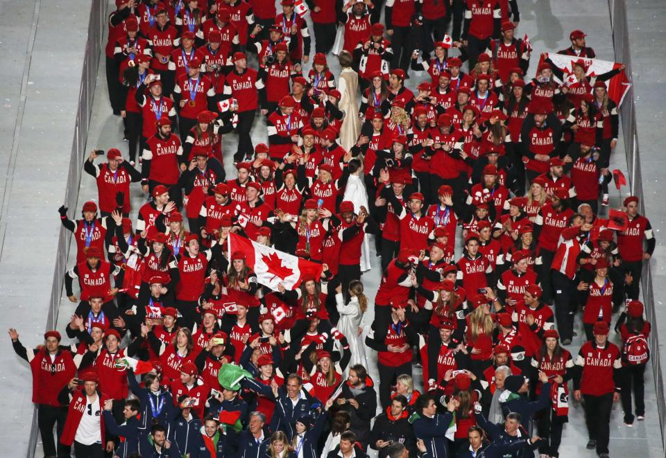 Athletes of Canada enter the stadium during the closing ceremony for the 2014 Sochi Winter Olympics, February 23, 2014. REUTERS/Eric Gaillard (RUSSIA - Tags: OLYMPICS SPORT)