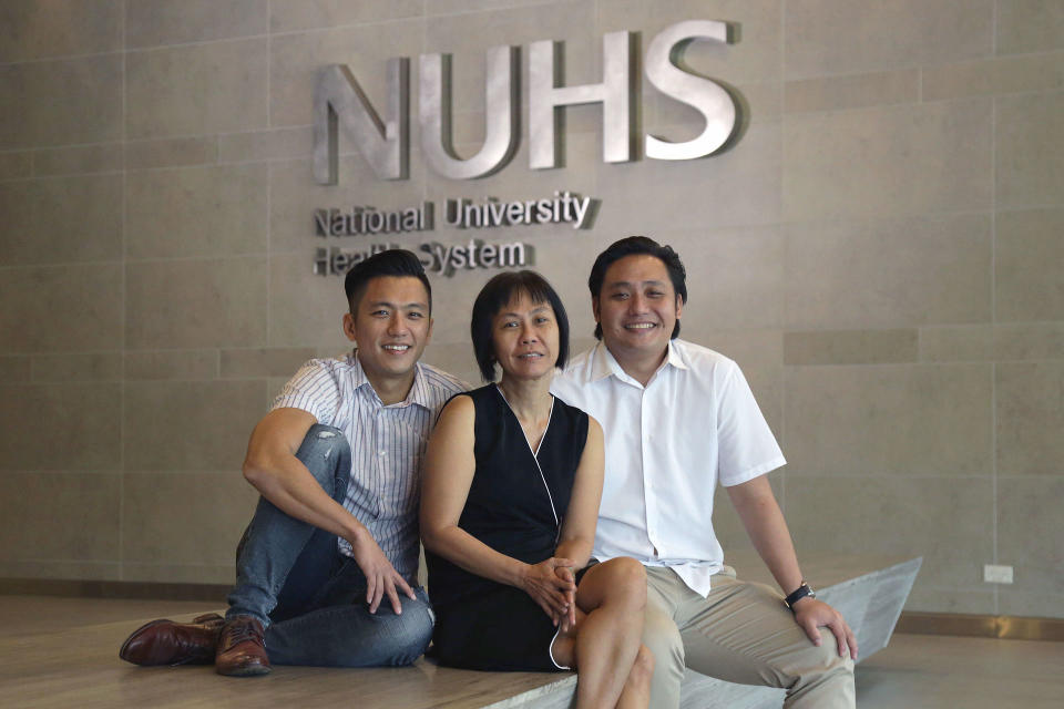 Serene Neo, 54, (middle) with her sons on 11 July, 2019. (PHOTO: Dhany Osman/Yahoo News Singapore)