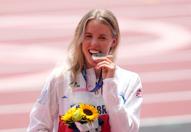  Great Britain’s Keely Hodgkinson bites her silver medal after finishing second in the Women’s 800m final at the Olympic Stadium on the twelfth day of the Tokyo 2020 Olympic Games in Japan