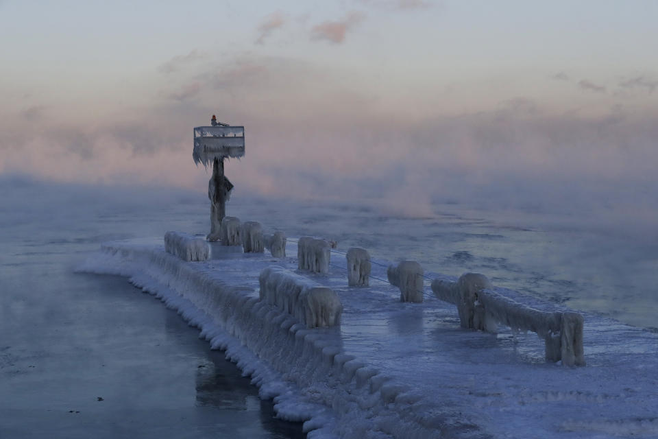 A harbor light is covered with snow and ice on the Lake Michigan at 39th Street Harbor, Jan. 30, 2019, in Chicago. (Photo: Nam Y. Huh/AP)