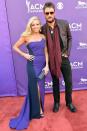 <p>The star — who's in the running for entertainer of the year and two other awards — and wife Katherine stunned on the 2013 carpet. </p> <p>Eric opted for a more casual look while Katherine donned a beautiful strapless gown with flowing blonde locks.</p>