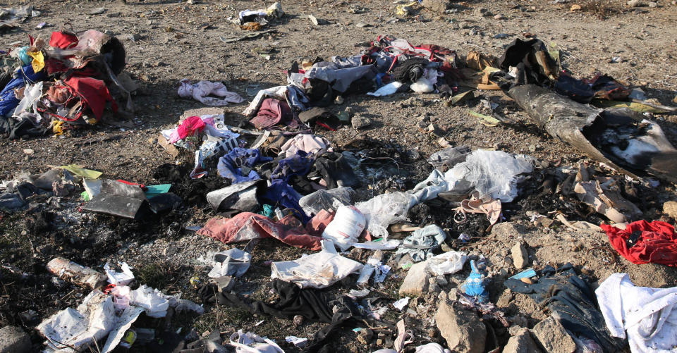 <em>NOTE: Graphic content </em>- Personal belongings and debris are pictured scattered on the ground after a Ukrainian plane carrying 176 passengers crashed near Imam Khomeini airport in the Iranian capital Tehran early in the morning on January 8, 2020, killing everyone on board. - The Boeing 737 had left Tehran's international airport bound for Kiev, semi-official news agency ISNA said, adding that 10 ambulances were sent to the crash site. (Photo by - / AFP) (Photo by -/AFP via Getty Images)