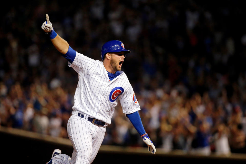 CHICAGO, IL - AUGUST 12:  David Bote #13 of the Chicago Cubs celebrates as he rounds the bases after hitting a walk-off grand slam against the Washington Nationals at Wrigley Field on August 12, 2018 in Chicago, Illinois. The Chicago Cubs won 4-3.  (Photo by Jon Durr/Getty Images)