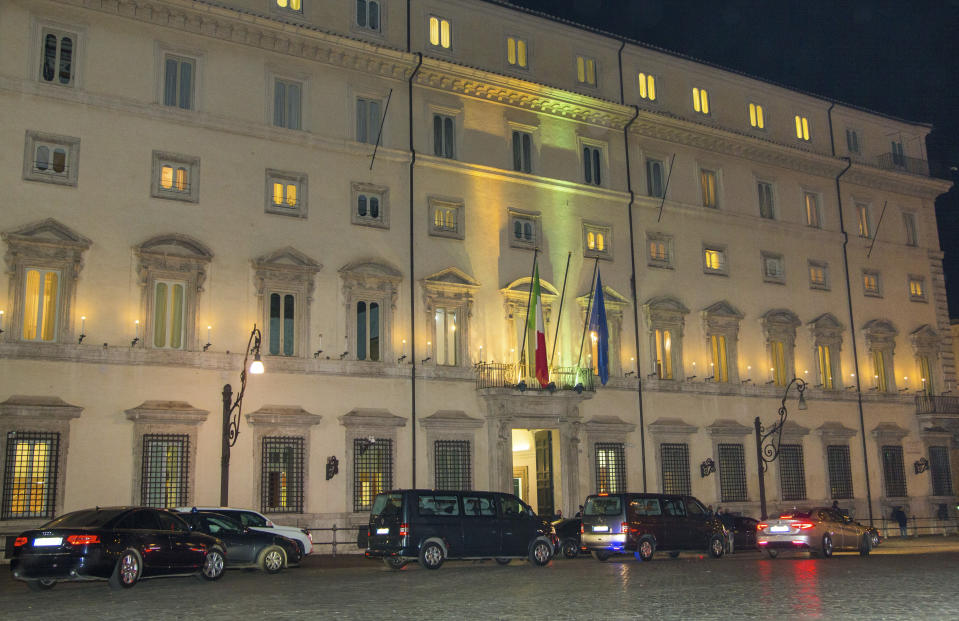 A motorcade allegedly carrying Libyan eastern-based forces General Khalifa Hifter leaves Italian Premier Giuseppe Conte's office in Rome, Wednesday, Jan. 8, 2020. Hifter traveled to Rome on Wednesday on a previously unannounced visit to meet with Italian Premier Giuseppe Conte. An Italian government spokesman, Rocco Casalino, said Serraj was expected to meet with Conte later in the evening. (AP Photo/Domenico Stinellis)