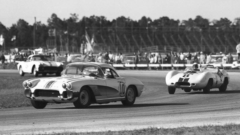 A black and white photo of a Corvette in a race. 