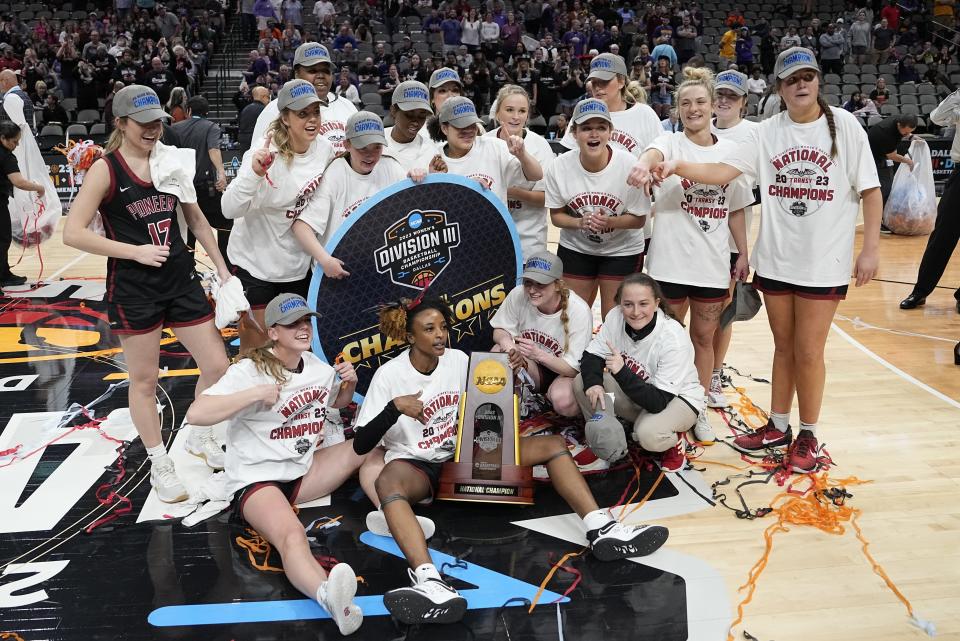 Transylvania players celebrate after winning the NCAA Women's Division 3 championship basketball game against Christopher Newport Saturday, April 1, 2023, in Dallas.(AP Photo/Darron Cummings)