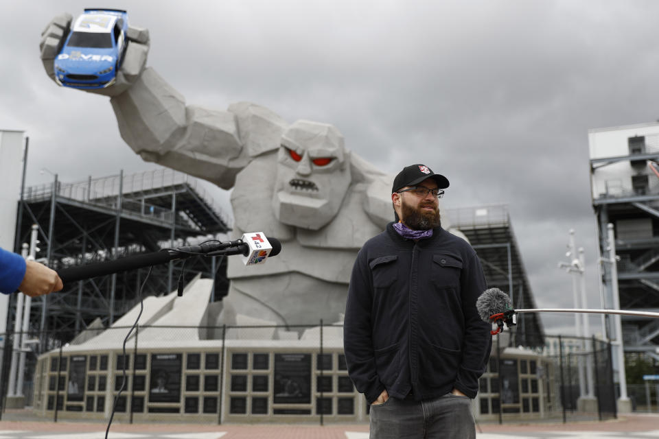 Doug Yorke, director of marketing at Dover International Speedway, speaks during a news conference outside the track, Monday, April 27, 2020, in Dover, Del. Sports will eventually start again and all signs indicate NASCAR is racing full speed ahead of the other major leagues in resuming competition. The sanctioning body is currently working on a revised schedule that could have NASCAR back on track in roughly three weeks. (AP Photo/Matt Slocum)