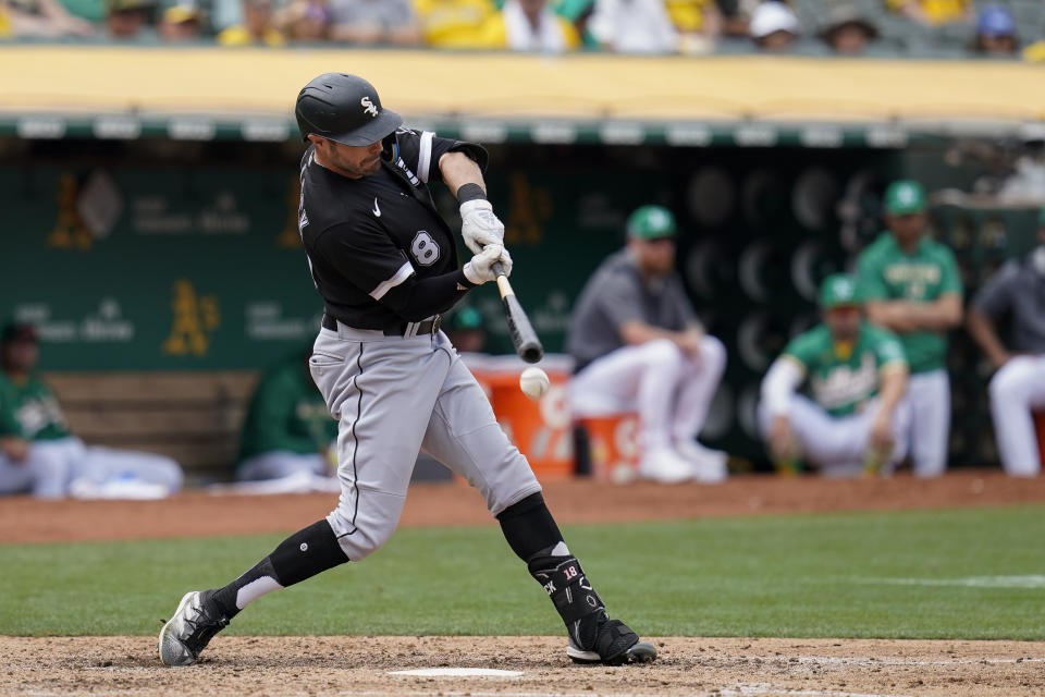 Chicago White Sox's AJ Pollock hits an RBI-single against the Oakland Athletics during the sixth inning of a baseball game in Oakland, Calif., Sunday, Sept. 11, 2022. (AP Photo/Godofredo A. Vásquez)