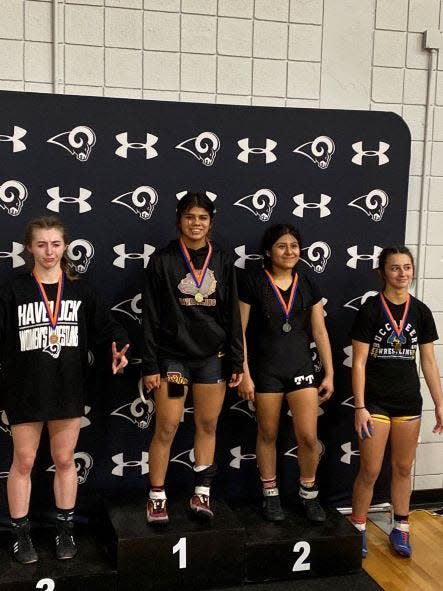 Dixon's Anabel Rodriguez, second from left, is one of several area athletes that will compete in the NCHSAA Women's Invitational wrestling tournament.