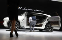 A member of the media looks over an Infiniti QX Inspiration concept vehicle at the North American International Auto Show in Detroit, Michigan, U.S., January 15, 2019. REUTERS/Brendan McDermid