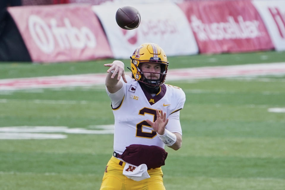 FILE - Minnesota quarterback Tanner Morgan (2) throws during the first half of an NCAA college football game against Nebraska in Lincoln, Neb., Saturday, Dec. 12, 2020. Many of Minnesota's upperclassmen cashed in on the bonus year of eligibility after the pandemic and returned for 2021, giving the Gophers one of the oldest teams in the Big Ten. The time is now for coach P.J. Fleck's group to take another step forward, led by running back Mo Ibrahim and quarterback Tanner Morgan, both in their fourth year. (AP Photo/Nati Harnik)